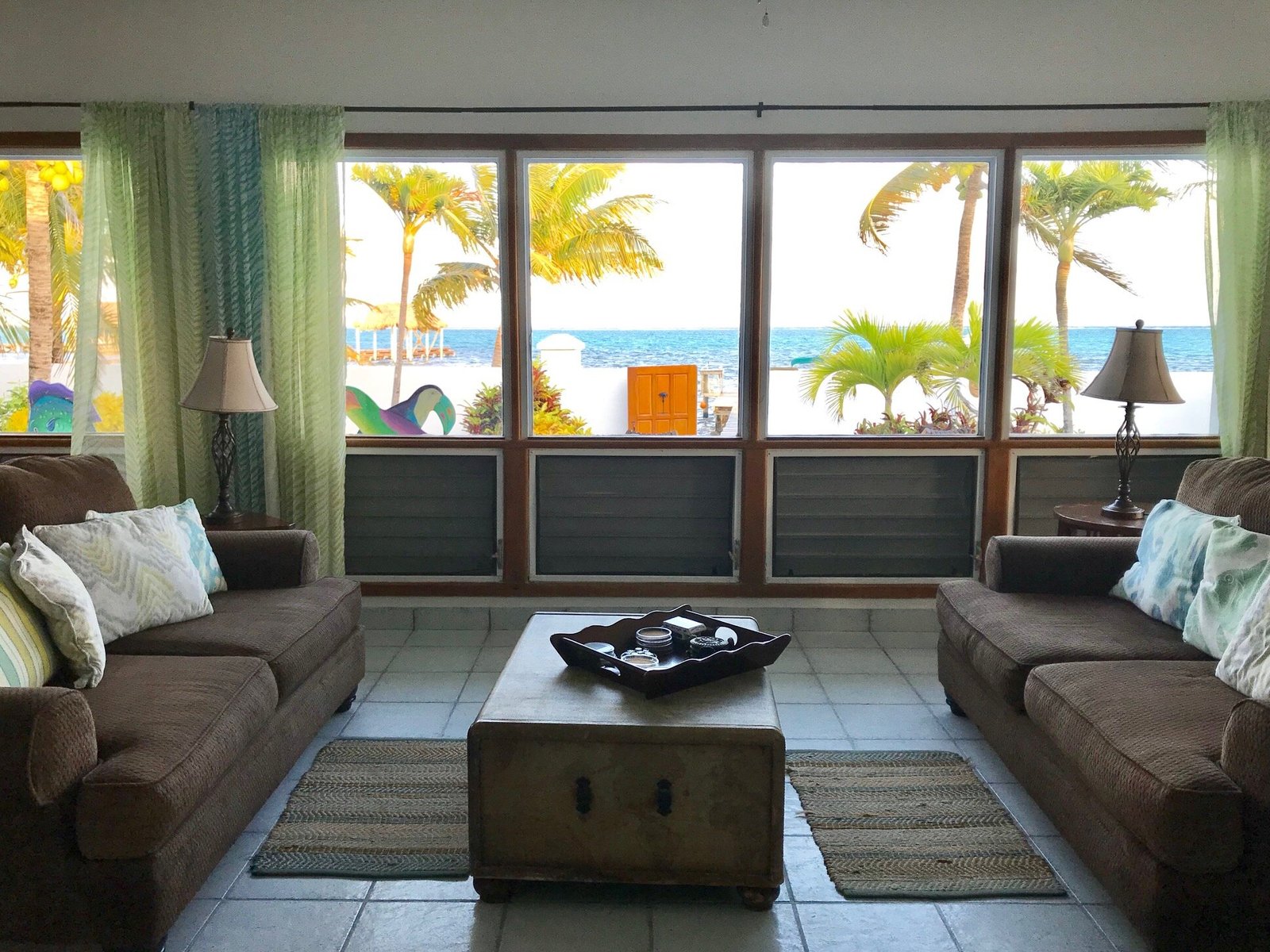 Pool deck and blue villa at Playa Blanca Island Villas in San Pedro, Belize
